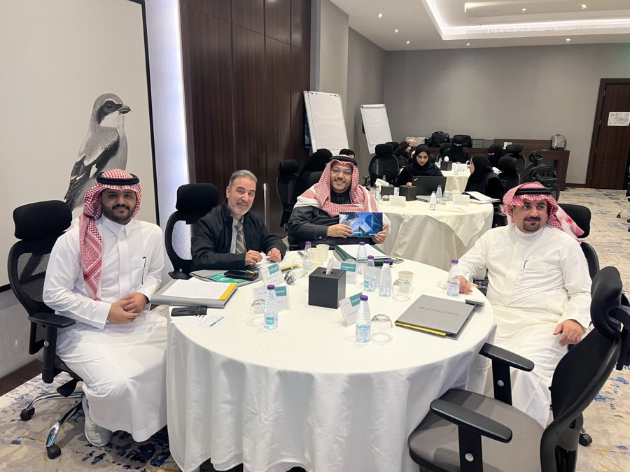 Delegates at a table with ICC Academy Incoterms materials in Dammam