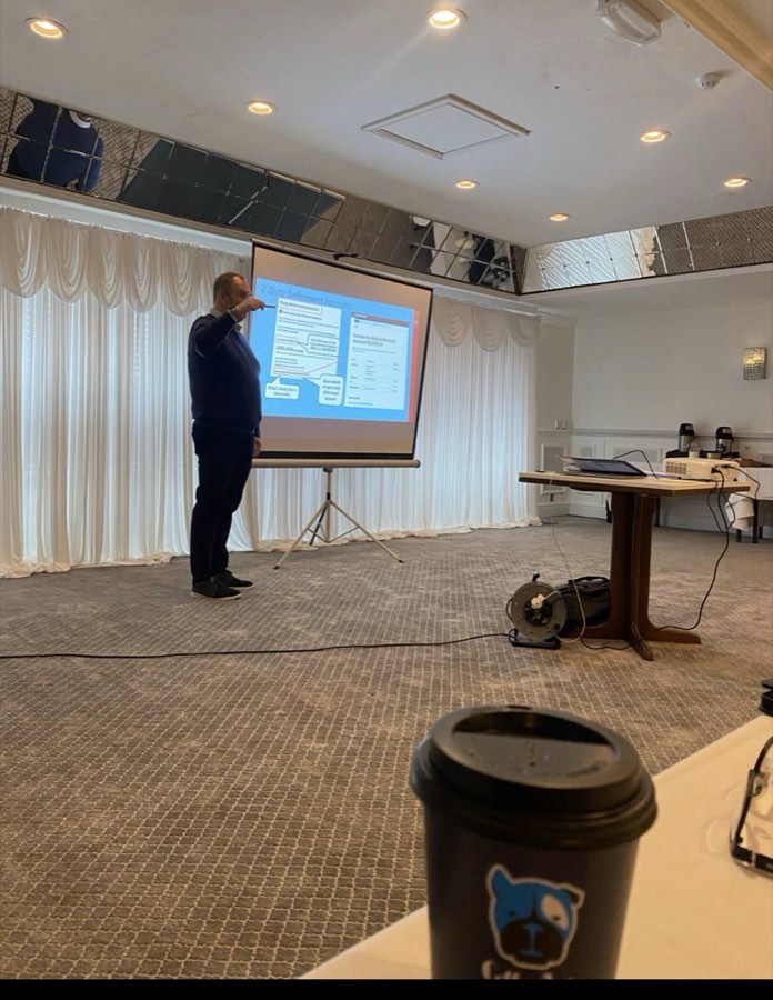 Richard Bartlett presenting a slide on duty deferment accounts at a UK course