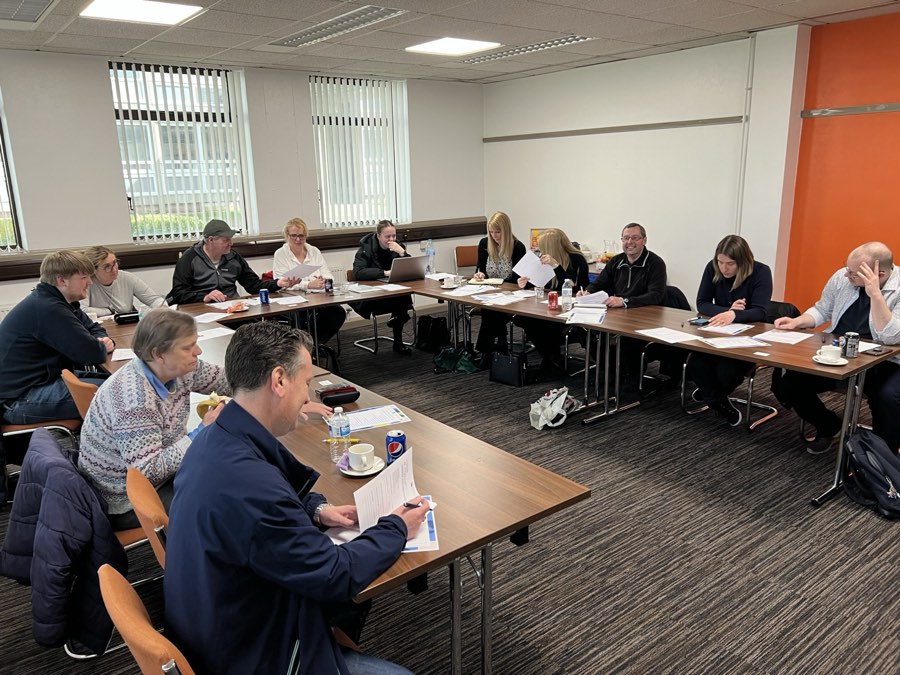 Delegates working through exercises at a UK trade course